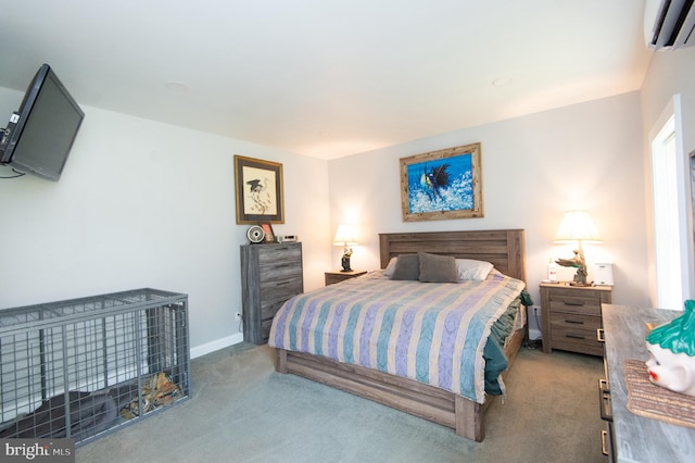 bedroom featuring an AC wall unit and carpet floors