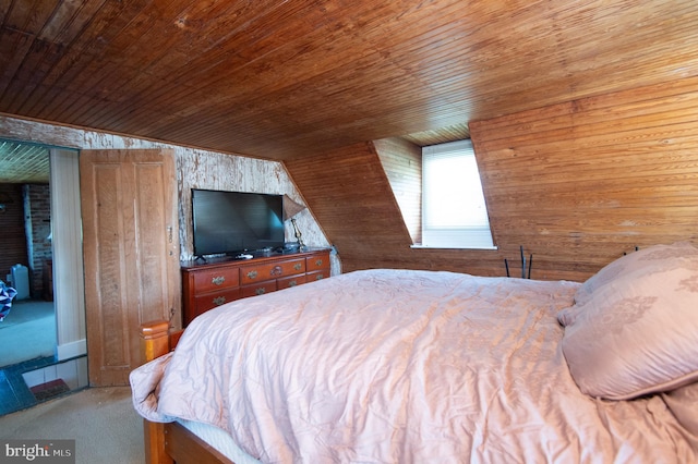 bedroom featuring wood ceiling, lofted ceiling, wooden walls, and carpet