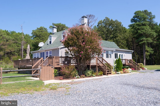 view of front of property with a wooden deck