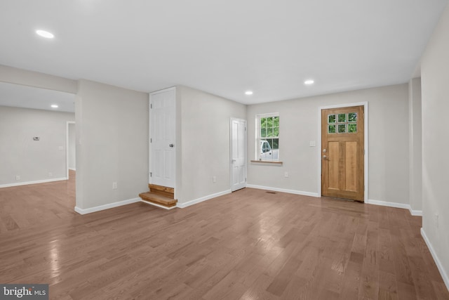 foyer entrance featuring wood-type flooring