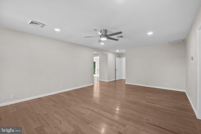 unfurnished room with wood-type flooring and ceiling fan