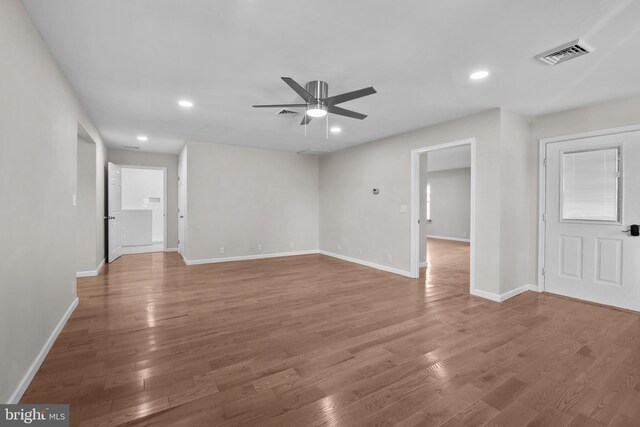 unfurnished room featuring ceiling fan and hardwood / wood-style flooring