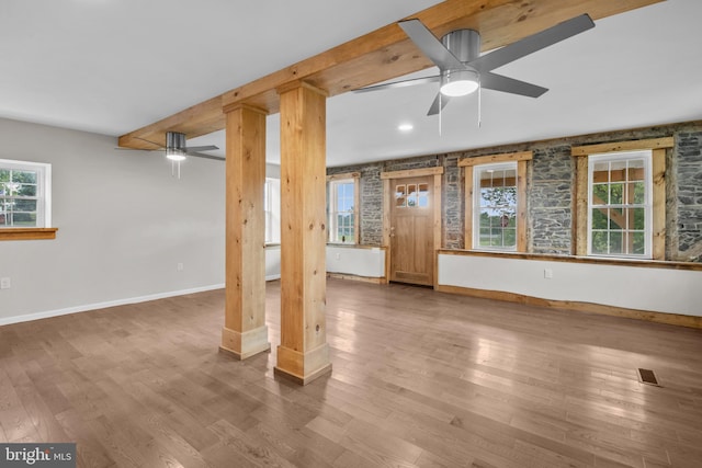 basement featuring ceiling fan and hardwood / wood-style flooring