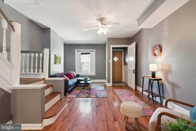 living room with ceiling fan and hardwood / wood-style floors