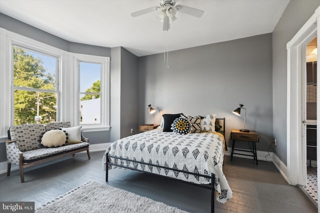 bedroom with ceiling fan and dark hardwood / wood-style floors