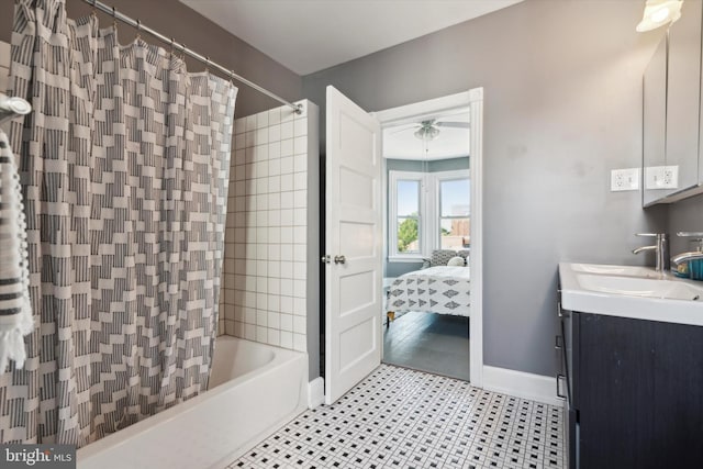 bathroom with ceiling fan, shower / bath combo with shower curtain, and vanity