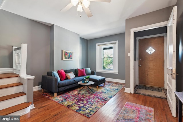 living room with hardwood / wood-style floors and ceiling fan