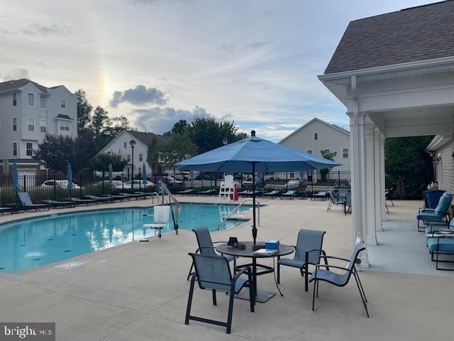 view of swimming pool featuring a patio area