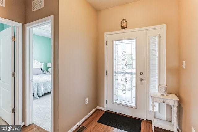 foyer entrance featuring a healthy amount of sunlight and light hardwood / wood-style flooring