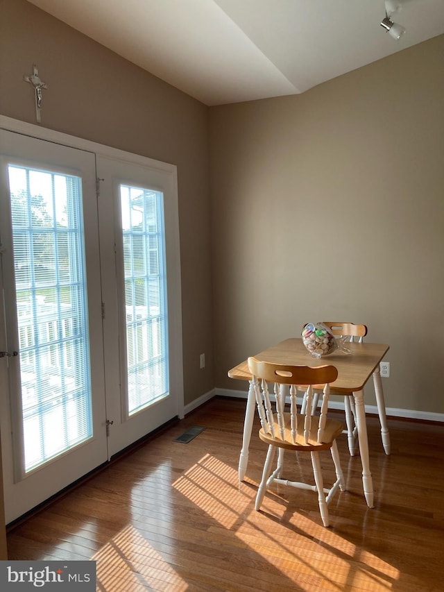 dining room with hardwood / wood-style floors