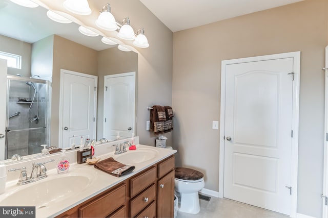 bathroom featuring toilet, dual bowl vanity, tile patterned flooring, and an enclosed shower