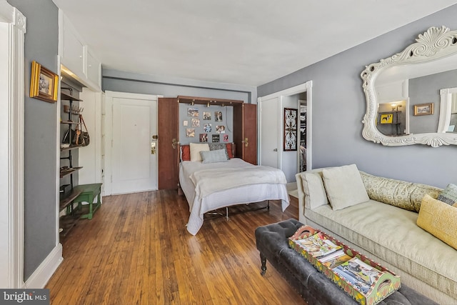 bedroom with hardwood / wood-style flooring