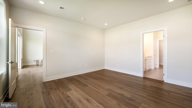 empty room featuring dark wood-style flooring and recessed lighting