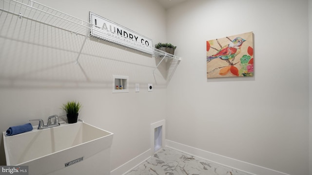 clothes washing area featuring laundry area, a sink, marble finish floor, hookup for a washing machine, and electric dryer hookup