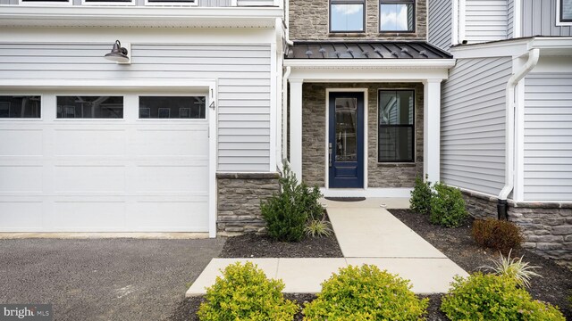 property entrance featuring a garage