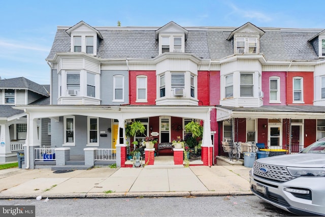 townhome / multi-family property with covered porch