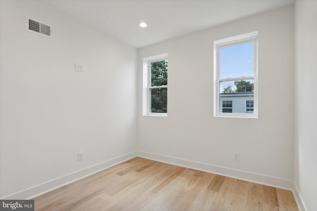 spare room with light wood-type flooring