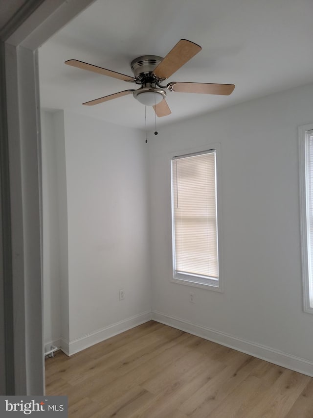 unfurnished room with ceiling fan and light wood-type flooring