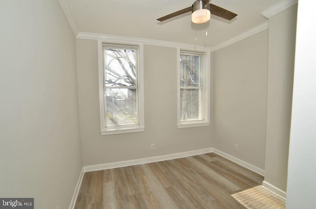 empty room with ornamental molding, ceiling fan, and light hardwood / wood-style floors