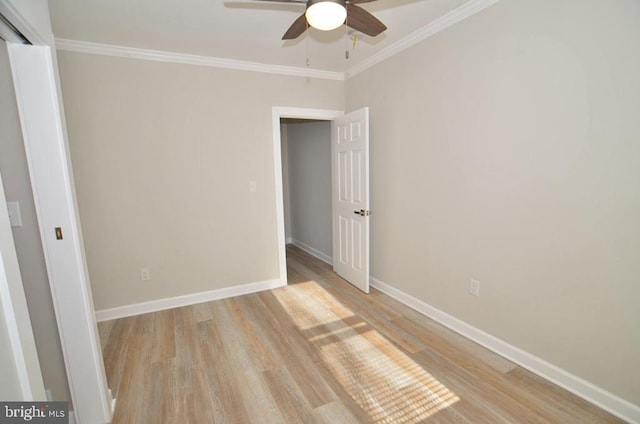 unfurnished room with ornamental molding, ceiling fan, and light hardwood / wood-style flooring