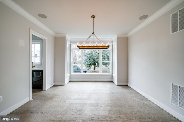 unfurnished dining area with plenty of natural light, wood finished floors, and visible vents