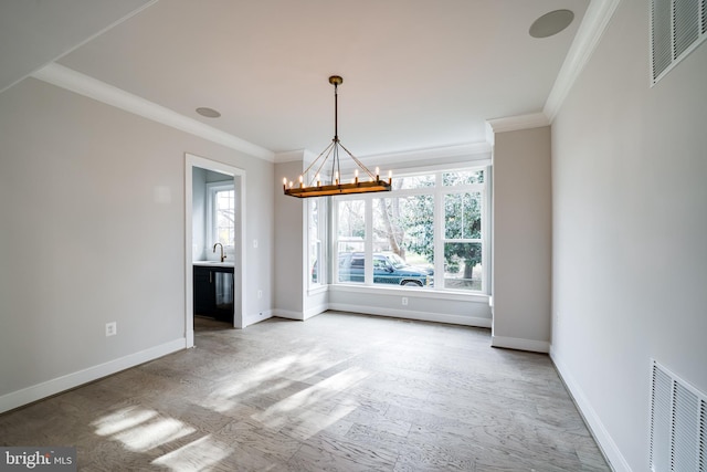 unfurnished dining area with a notable chandelier, baseboards, visible vents, and crown molding