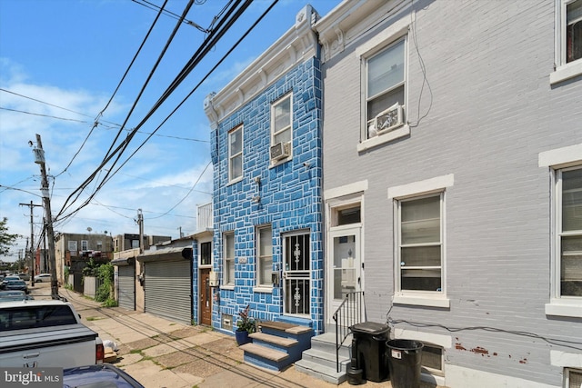 view of front of property featuring cooling unit