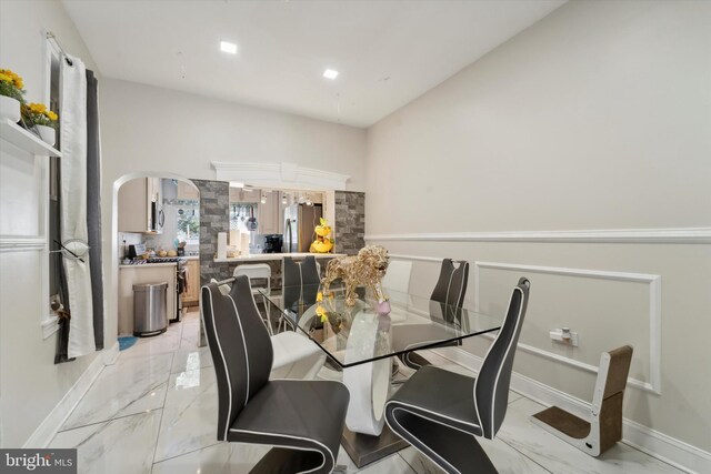 dining area featuring light tile patterned floors