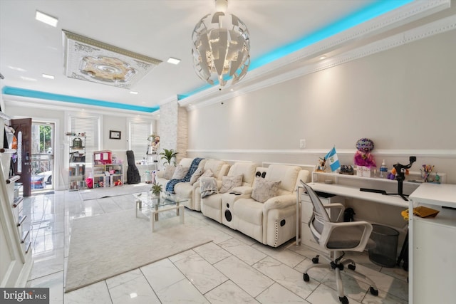 office featuring an inviting chandelier, a tray ceiling, and ornamental molding