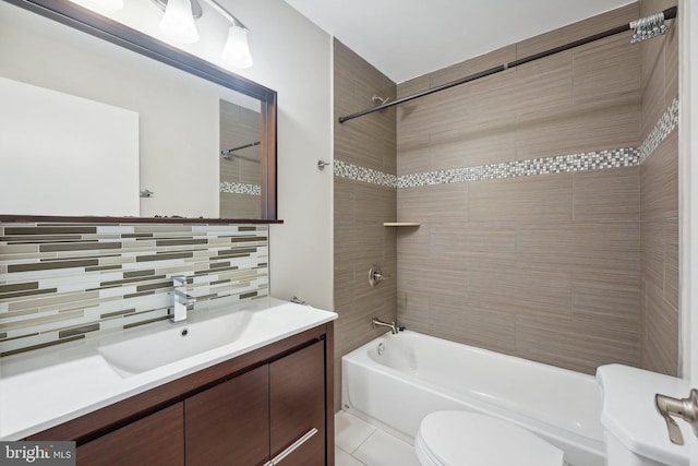 full bathroom featuring tiled shower / bath combo, vanity, backsplash, and toilet