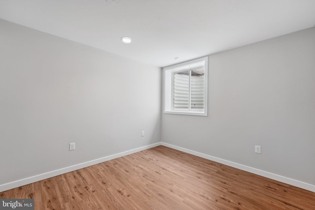 unfurnished room featuring hardwood / wood-style flooring