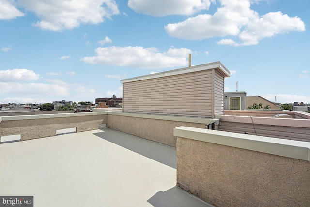 view of patio featuring a balcony