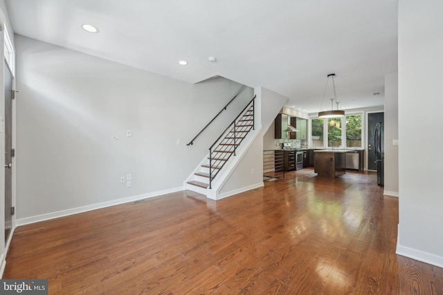 foyer entrance featuring dark hardwood / wood-style flooring