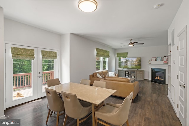 dining space featuring ceiling fan, dark hardwood / wood-style floors, and french doors