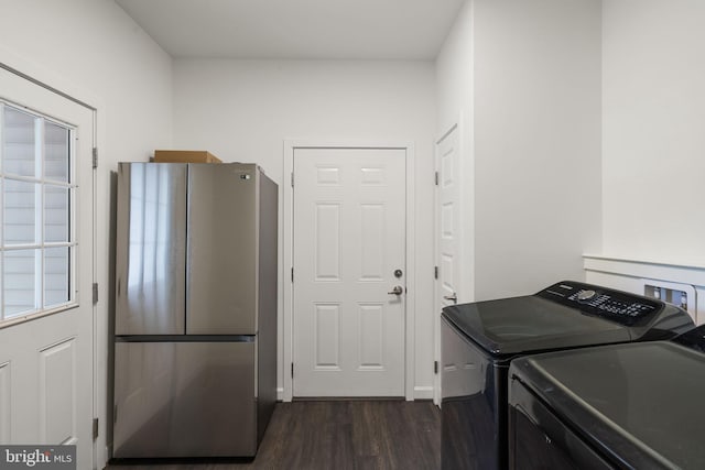 washroom with dark hardwood / wood-style floors and independent washer and dryer