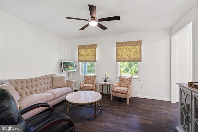 living room with dark hardwood / wood-style flooring and ceiling fan