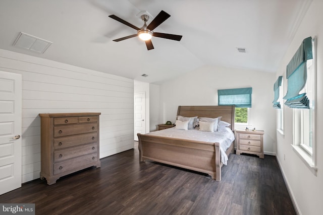 bedroom with ceiling fan, dark hardwood / wood-style flooring, and vaulted ceiling