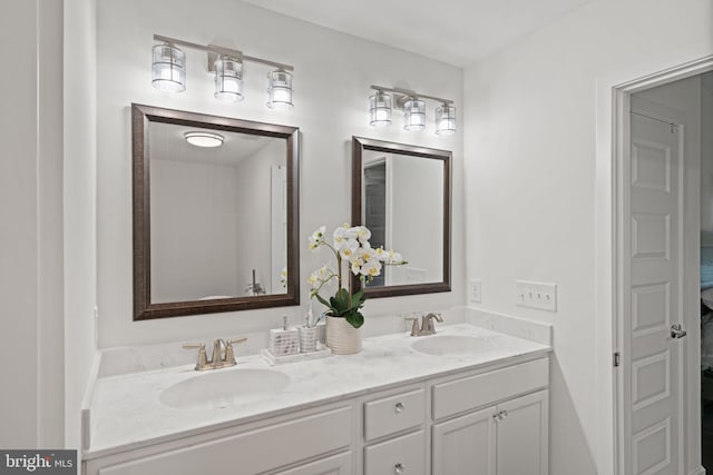 bathroom with dual vanity