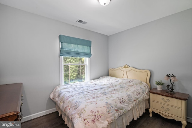 bedroom featuring dark hardwood / wood-style flooring