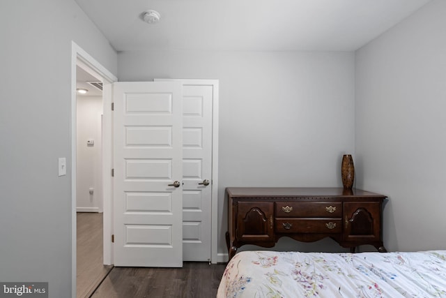 bedroom featuring dark hardwood / wood-style flooring