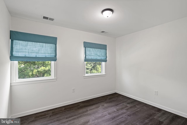 spare room featuring hardwood / wood-style flooring