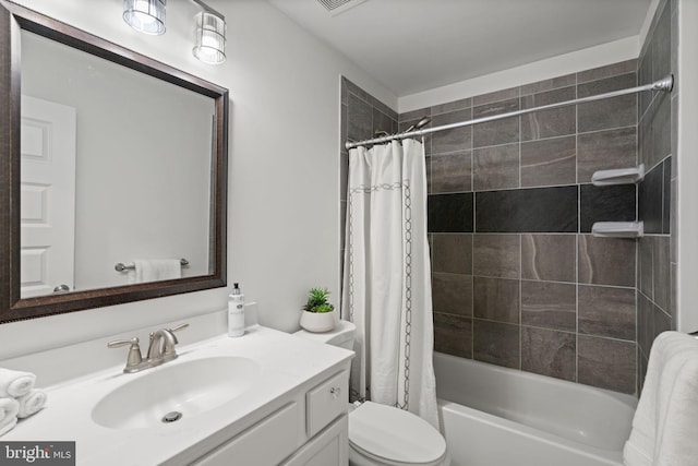 full bathroom featuring toilet, vanity, and shower / tub combo