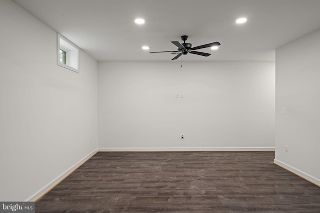 basement with ceiling fan and hardwood / wood-style floors