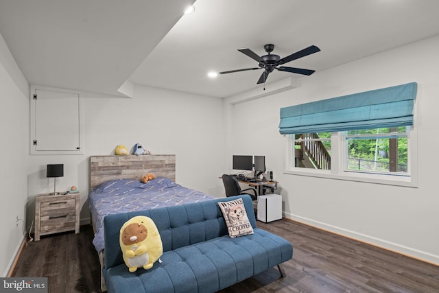 bedroom featuring ceiling fan and dark hardwood / wood-style floors