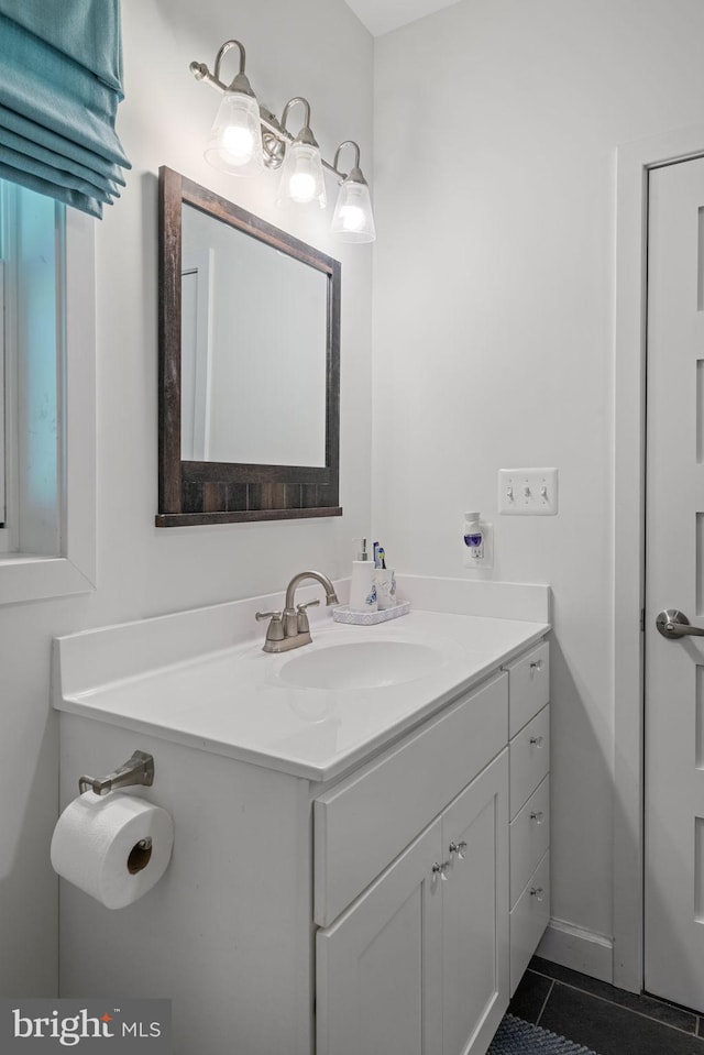 bathroom with tile patterned flooring and vanity