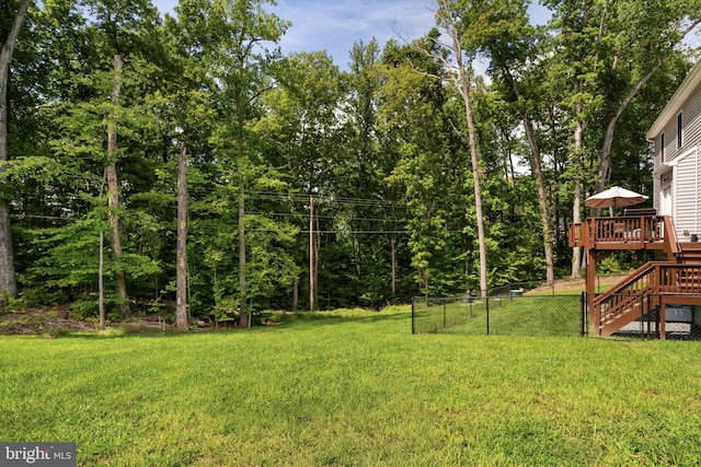 view of yard with a wooden deck