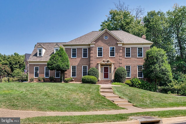 colonial home with a front yard