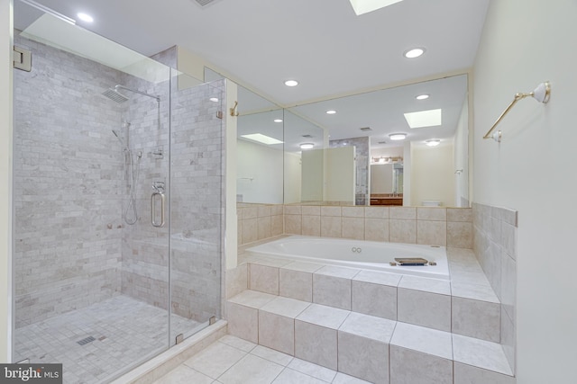 bathroom featuring tile patterned floors and separate shower and tub