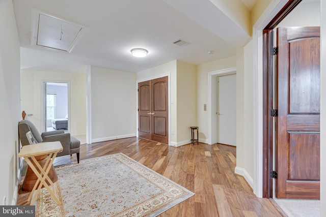 sitting room featuring light hardwood / wood-style flooring