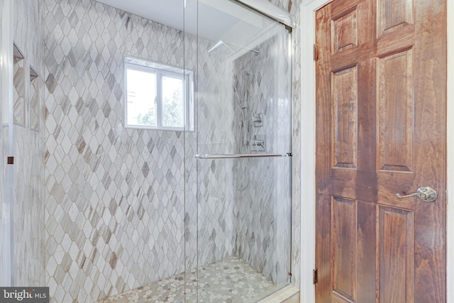 bathroom featuring an enclosed shower